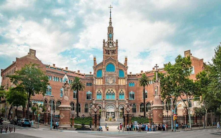 Barcelona Beyond Gaudí: Modernism, Rooftops, and Hidden Gems - Walking Passeig de Gràcia with the famous façades overhead