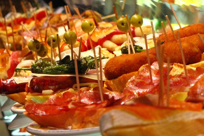 Private Tapas Walking Tour in Barcelona Modernist Area with Dinner included - What the guide adds between the meals